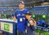 Nine-year-old Derek Rodriguez poses for a photo with Mike Lanzillotta, the Blue Jays fan who caught Aaron Judge's home run ball a night earlier and handed it to the youngster, before the start of American baseball action against the Toronto Blue Jays in Toronto on Wednesday May 4, 2022. The young New York Yankees fan's dreams came true on Tuesday night in Toronto when he was handed a home-run ball hit by Aaron Judge. A clip of the interaction quickly went viral. Rodriguez and Lanzillotta were on hand to watch batting practice Wednesday afternoon and later met Judge in the Yankees dugout. THE CANADIAN PRESS/Gregory Strong