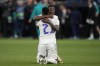 Real Madrid players react after the Champions League semi final, second leg, soccer match between Real Madrid and Manchester City at the Santiago Bernabeu stadium in Madrid, Spain, Wednesday, May 4, 2022. Real won 3-1. (AP Photo/Bernat Armangue)