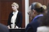 Actor Amber Heard, left, and actor Johnny Depp appear in the courtroom at the Fairfax County Circuit Court in Fairfax, Va., Thursday, May 5, 2022. Depp sued his ex-wife Heard for libel in Fairfax County Circuit Court after she wrote an op-ed piece in The Washington Post in 2018 referring to herself as a 