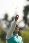 Jasmine Suwannapura throws grass in the air at the 17th tee during the final round of the LPGA's Palos Verdes Championship golf tournament on Sunday, May 1, 2022, in Palos Verdes Estates, Calif. (AP Photo/Ashley Landis)