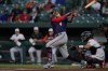 Minnesota Twins' Carlos Correa follows through on a swing against the Baltimore Orioles during the first inning of a baseball game, Thursday, May 5, 2022, in Baltimore. (AP Photo/Julio Cortez)