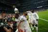 Real Madrid's Karim Benzema, center, celebrates after scoring his side's third goal during the Champions League semi final, second leg soccer match between Real Madrid and Manchester City at the Santiago Bernabeu stadium in Madrid, Spain, Wednesday, May 4, 2022. (AP Photo/Manu Fernandez)