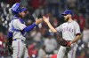 Texas Rangers pitcher Joe Barlow, right, and catcher Jonah Heim celebrate after the Rangers won a baseball game against the Philadelphia Phillies, Wednesday, May 4, 2022, in Philadelphia. (AP Photo/Matt Slocum)