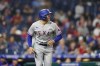 Texas Rangers' Brad Miller reacts after hitting a two-run single against Philadelphia Phillies pitcher Brad Hand during the 10th inning of a baseball game, Wednesday, May 4, 2022, in Philadelphia. (AP Photo/Matt Slocum)