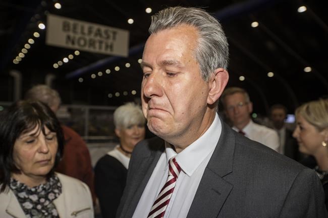 An emotional Edwin Poots, after being elected for South Belfast as a DUP MLA Northern Ireland Assembly Election, pays tribute to his colleague Christopher Stalford, a Democratic Unionist party member of the Northern Ireland assembly who died suddenly in February, in Belfast, Northern Ireland, Friday, May 6, 2022. Poots was asked by Mr Stalford's family to stand for the constituency in honor of his late friend. (Liam McBurney/PA via AP)