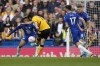 Wolverhampton Wanderers' Francisco Trincao, second from left, scores his side's opening goal during the English Premier League soccer match between Chelsea and Wolverhampton at Stamford Bridge stadium, in London, Saturday, May 7, 2022. (AP Photo/Frank Augstein)
