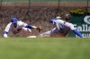 Los Angeles Dodgers' Freddie Freeman, right, slides safely into second base after hitting a one-run double as Chicago Cubs shortstop Nico Hoerner tries to make the tag during the first inning in the first baseball game of a doubleheader, Saturday, May 7, 2022, in Chicago. (AP Photo/Nam Y. Huh)