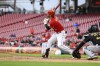 Cincinnati Reds' Tyler Naquin hits a two-run double during the eighth inning in the first baseball game of a doubleheader against the Pittsburgh Pirates in Cincinnati, Saturday, May 7, 2022. The Reds won 9-2. (AP Photo/Aaron Doster)