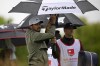 Jason Day of, Australia, dries his hands on the second tee during the third round of the Wells Fargo Championship golf tournament, Saturday, May 7, 2022, at TPC Potomac at Avenel Farm golf club in Potomac, Md. (AP Photo/Nick Wass)