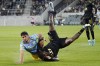 Philadelphia Union forward Julian Carranza, left, and Los Angeles FC defender Sebastien Ibeagha tangle during the first half of a Major League Soccer match Saturday, May 7, 2022, in Los Angeles. (AP Photo/Mark J. Terrill)