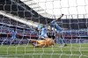 Manchester City's Aymeric Laporte, center, scores his side's second goal during the English Premier League soccer match between Manchester City and Newcastle United at Etihad stadium in Manchester, England, Sunday, May 8, 2022. (AP Photo/Jon Super)