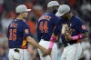 Houston Astros' Aledmys Diaz (16), Yordan Alvarez (44) and Jose Siri celebrate after a baseball game against the Detroit Tigers Sunday, May 8, 2022, in Houston. The Astros won 5.0.(AP Photo/David J. Phillip)