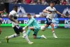 Toronto FC goalkeeper Alex Bono, centre, watches as Vancouver Whitecaps' Tosaint Ricketts, front left, scores after receiving a pass from Lucas Cavallini, back right, during the second half of an MLS soccer game in Vancouver, B.C., Sunday, May 8, 2022. THE CANADIAN PRESS/Darryl Dyck