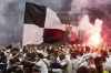 Frankfurt's fans invade the pitch to celebrate after the Europa League semi final second leg soccer match between Eintracht Frankfurt and West Ham United in Frankfurt, Germany, Thursday, May 5, 2022. (AP Photo/Michael Probst)