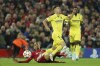 Villarreal's Giovani Lo Celso, right, is fouled by Liverpool's Fabinho during the Champions League semi final, first leg soccer match between Liverpool and Villarreal at Anfield stadium in Liverpool, England, Wednesday, April 27, 2022. (AP Photo/Jon Super)