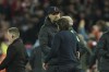 Liverpool's manager Jurgen Klopp, left, cheers Tottenham's head coach Antonio Conte at the end of the English Premier League soccer match between Liverpool and Tottenham Hotspur at Anfield stadium in Liverpool, England, Saturday, May 7, 2022. (AP Photo/Jon Super)