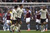 Liverpool's Joel Matip, second left, celebrates his goal against Aston Villa during the English Premier League soccer match between Aston Villa and Liverpool at Villa Park in Birmingham, England, Tuesday, May 10, 2022. (AP Photo/Rui Vieira)