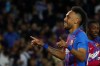 Barcelona's Pierre-Emerick Aubameyang, left, celebrates after scoring his side's third goal during the Spanish La Liga soccer match between FC Barcelona and Celta Vigo at the Camp Nou stadium in Barcelona, Spain, Tuesday, May 10, 2022. (AP Photo/Joan Monfort)