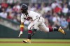 Atlanta Braves' Ronald Acuna Jr. steals second base in the first inning of a baseball game against the Boston Red Sox, Tuesday, May 10, 2022, in Atlanta. (AP Photo/John Bazemore)