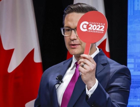 Pierre Poilievre holds his