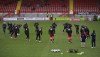 FILE - Crawley Town's players warm up before the English FA Cup third round soccer match between Crawley Town and Leeds United at Broadfield Stadium in Crawley, England, Sunday, Jan. 10, 2021. An American consortium has bought Crawley Town with the ultimate aim of winning the Premier League title. The unheralded fourth-division club located south of London has been bought by a group of investors pledging to “shake up the status quo” by using the world of cryptocurrency and so-called “Web 3” technology to fuel the rise of a sports team. It’s a plunge into the unknown for Crawley and perhaps a sign of what's to come in soccer worldwide.(AP Photo/Ian Walton, File)