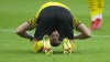FILE - Dortmund's Erling Haaland watches through his legs during the German Bundesliga soccer match between Borussia Dortmund and Eintracht Frankfurt in Dortmund, Germany, Saturday, Aug. 14, 2021. Erling Haaland looks sure to be coming home. The future of the Norway striker is set to be finalized this week and the expectation is he will leave Borussia Dortmund to join Manchester City as the English club’s belated replacement for Sergio Aguero. The 21-year-old Haaland is one of the rising stars of world soccer. (AP Photo/Martin Meissner, File)