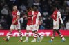Arsenal players leave the pitch for the halftime during the English Premier League soccer match between Tottenham Hotspur and Arsenal at Tottenham Hotspur stadium in London, England, Thursday, May 12, 2022. (AP Photo/Matt Dunham)