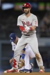 Philadelphia Phillies' Bryce Harper (3) reacts after hitting an RBI double against the Los Angeles Dodgers during the fifth inning of a baseball game in Los Angeles, Thursday, May 12, 2022. (AP Photo/Kyusung Gong)