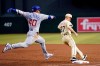 Arizona Diamondbacks starting pitcher Zach Davies (27) beats Chicago Cubs' Willson Contreras (40) to first base for an out during the third inning of a baseball game Friday, May 13, 2022, in Phoenix. (AP Photo/Ross D. Franklin)