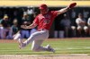 Los Angeles Angels' Mike Trout slides home to score against the Oakland Athletics during the eighth inning of the first baseball game of a doubleheader in Oakland, Calif., Saturday, May 14, 2022. (AP Photo/Jeff Chiu)