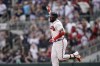 Atlanta Braves' Marcell Ozuna (20) celebrates after hitting a two-run home run in the eighth inning of a baseball game against the San Diego Padres, Saturday, May 14, 2022, in Atlanta. (AP Photo/Brynn Anderson)