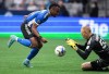 San Jose Earthquakes' Jeremy Ebobisse, left, chases down the ball as Vancouver Whitecaps goalkeeper Cody Cropper makes the save during the first half of an MLS soccer game in Vancouver, on Saturday, May 14, 2022. THE CANADIAN PRESS/Darryl Dyck