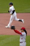 Pittsburgh Pirates' Daniel Vogelbach (19) runs the bases after hitting a solo home run off Cincinnati Reds starting pitcher Luis Castillo, foreground, during the fourth inning of a baseball game in Pittsburgh, Saturday, May 14, 2022. (AP Photo/Gene J. Puskar)