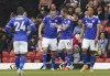 Leicester City's Jamie Vardy, second left, is congratulated by teammate James Maddison after scoring during the English Premier League soccer match between Watford and Leicester City at Vicarage Road, Watford, England, Sunday May 15, 2022. (Jonathan Brady/PA via AP)