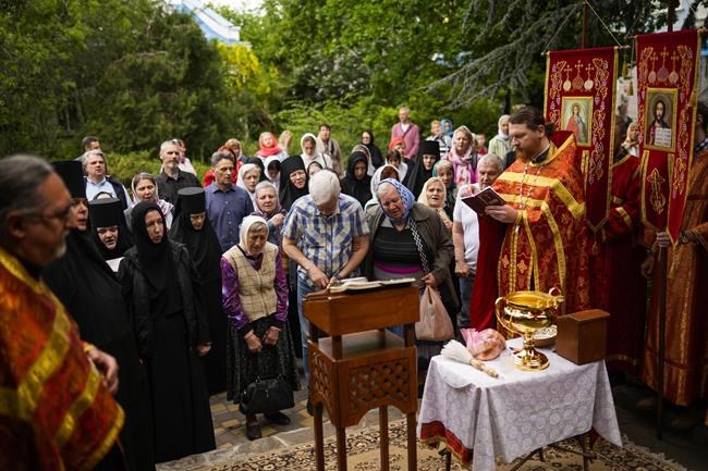Christian Orthodox worshippers attend a service at Archangel Saint Michael monastery, in Odesa, Ukraine, on Sunday, May 15, 2022. Almost three months after Russia shocked the world by invading Ukraine, its military faces a bogged-down war. (AP Photo/Francisco Seco)