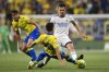 Real Madrid's Dani Ceballos, right, is tackled by Cadiz's Iza Carcelen during a Spanish La Liga soccer match between Cadiz and Real Madrid at the Nuevo Mirandilla stadium in Cadiz, Spain, Sunday, May 15, 2022. (AP Photo/Jose Breton)