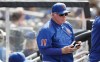 New York Mets manager Buck Showalter (11) stands in the dugout during a baseball game against the Seattle Mariners during the sixth inning, Sunday, May 15, 2022, in New York. (AP Photo/Noah K. Murray)