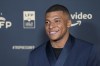 Paris Saint Germain's Kylian Mbappe poses as he arrives at the UNFP (Union of French Professional Footballers) ceremony, in Paris, France, Sunday, May 15, 2022. (AP Photo/Michel Euler)
