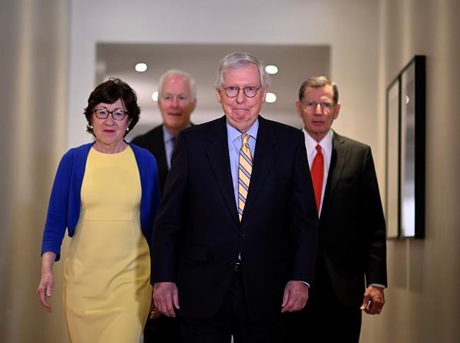 U.S. Republican Sens. Mitch McConnell, center, and from left, Susan Collins, John Cornyn and John Barrasso prepare to meet with Swedish media at the Grand Hotel in Stockholm after a meeting with Swedish Prime Minister Magdalena Andersson and Minister of Defense Peter Hultqvist on Sunday, May 15, 2022. McConnell said Sunday that Finland and Sweden would be “important additions” to NATO as he led a delegation of GOP senators to the region in a show of support against Russia's aggression. (Anders Wiklund/TT News Agency via AP)