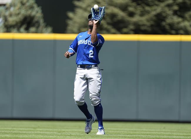 Kansas City Royals center fielder Michael A. Taylor pulls in a fly ball off the bat of Colorado Rockies' Randal Grichuk in the second inning of a baseball game Sunday, May 15, 2022, in Denver. (AP Photo/David Zalubowski)