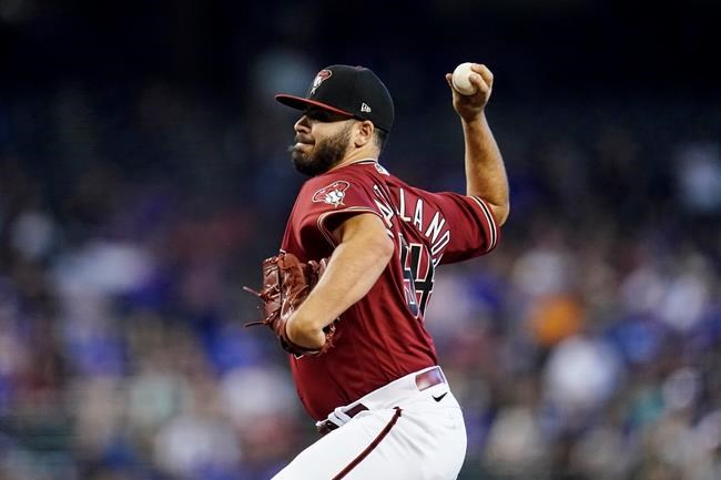 Arizona Diamondbacks starting pitcher Humberto Castellanos throws against the Chicago Cubs during the first inning of a baseball game Sunday, May 15, 2022, in Phoenix. (AP Photo/Ross D. Franklin)