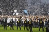 Frankfurt's fans invade the pitch to celebrate after the Europa League semi final second leg soccer match between Eintracht Frankfurt and West Ham United in Frankfurt, Germany, Thursday, May 5, 2022. (AP Photo/Michael Probst)