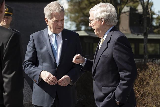 President of Finland Sauli Niinisto, left, shares a word with and U.S. Senate Minority Leader Mitch McConnell after their meeting the President's official residence Mantyniemi in Helsinki, Finland, Monday, May 16, 2022. (Roni Rekomaa/Lehtikuva via AP)