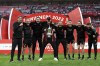 Liverpool's manager Jurgen Klopp poses with the trophy after wining the English FA Cup final soccer match between Chelsea and Liverpool, at Wembley stadium, in London, Saturday, May 14, 2022. Liverpool won 6-5 on penalties after the game ended in a goalless draw. (AP Photo/Ian Walton)