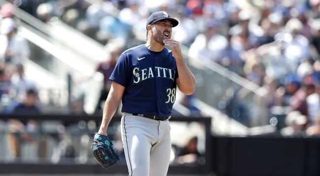 Seattle Mariners starting pitcher Robbie Ray (38) reacts after giving up runs against the New York Mets during the fourth inning of a baseball game in New York, Sunday, May 15, 2022. Ray did not travel with the Seattle Mariners for their series in Toronto against the Blue Jays. THE CANADIAN PRESS/AP-Noah K. Murray