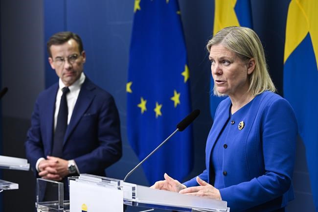 Sweden's Prime Minister Magdalena Andersson, right, and the Moderate Party's leader Ulf Kristersson give a news conference in Stockholm, Sweden, Monday, May 16, 2022. Sweden's government has decided to apply for a NATO membership. (Henrik Montgomery/TT News Agency via AP)