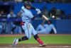 Toronto Blue Jays second baseman Santiago Espinal (5) his a foul ball against the Seattle Mariners during sixth inning American League, MLB baseball action in Toronto on Monday, May 16, 2022. THE CANADIAN PRESS/Nathan Denette