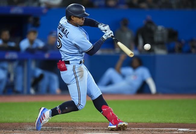 Toronto Blue Jays second baseman Santiago Espinal (5) his a foul ball against the Seattle Mariners during sixth inning American League, MLB baseball action in Toronto on Monday, May 16, 2022. THE CANADIAN PRESS/Nathan Denette
