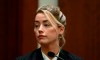 Actor Amber Heard testifies in the courtroom at the Fairfax County Circuit Courthouse in Fairfax, Va., Tuesday, May 17, 2022. Actor Johnny Depp sued his ex-wife Amber Heard for libel in Fairfax County Circuit Court after she wrote an op-ed piece in The Washington Post in 2018 referring to herself as a 