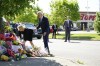 President Joe Biden and first lady Jill Biden visit the scene of a shooting at a supermarket to pay respects and speak to families of the victims of Saturday's shooting in Buffalo, N.Y., Tuesday, May 17, 2022. (AP Photo/Andrew Harnik)